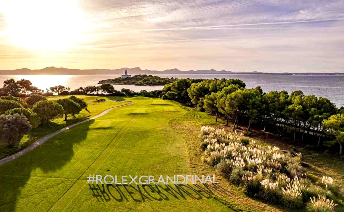Club de Golf Alcanada at golden hour with lighthouse and bay