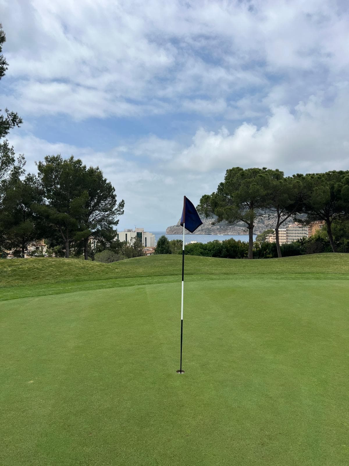 Hole 2 at Golf de Andratx with Camp del Mar visible in the background