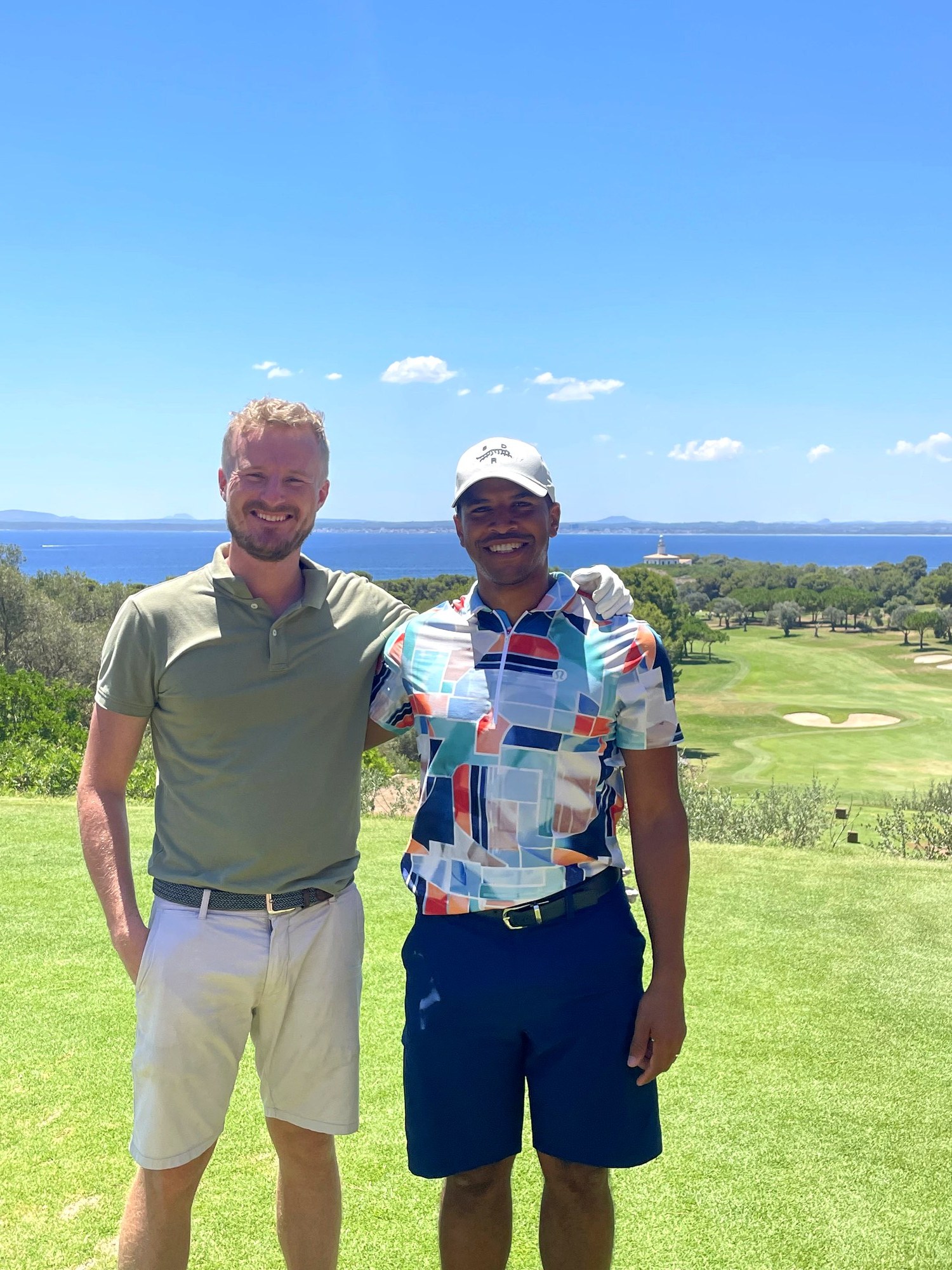 Golfers at Alcanada with the Mediterranean behind